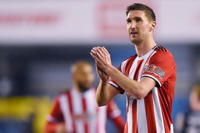 Chris Basham of Sheffield United thanks the fans at the end of the FA Cup match at The Den: Robin Parker/Sportimage