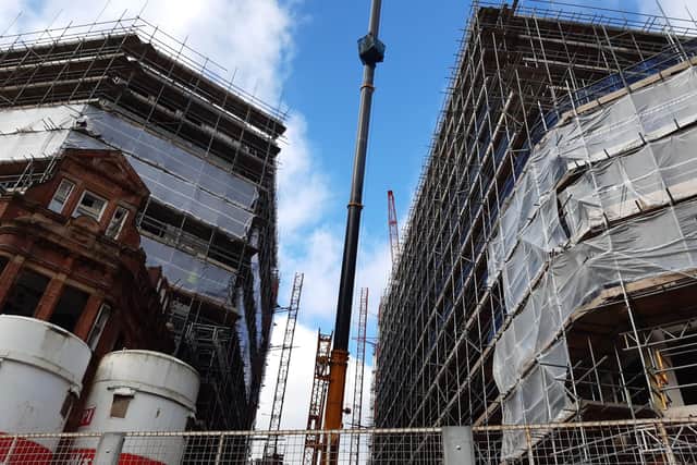 ‘About half' of the apartments in Burgess House on Pinstone Street have already been sold. It is set to open, with the Isaacs building, in February.