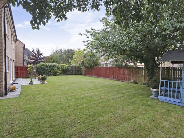 The garden wraps around the front and the side of the house
