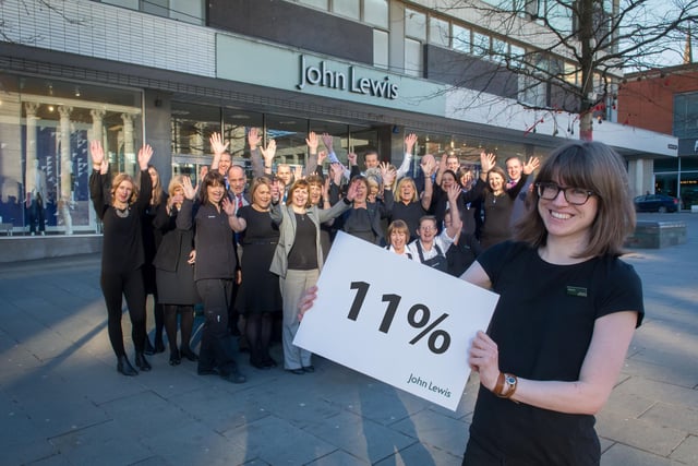 Visual merchandiser Jess Margetts celebrates the 11 per cent staff bonus at John Lewis in Sheffield with her fellow partners in March 2015