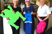 Catering assistants Emma Myers, Pam Bower and Sharon Scanlon are swimming for Big House Heroes