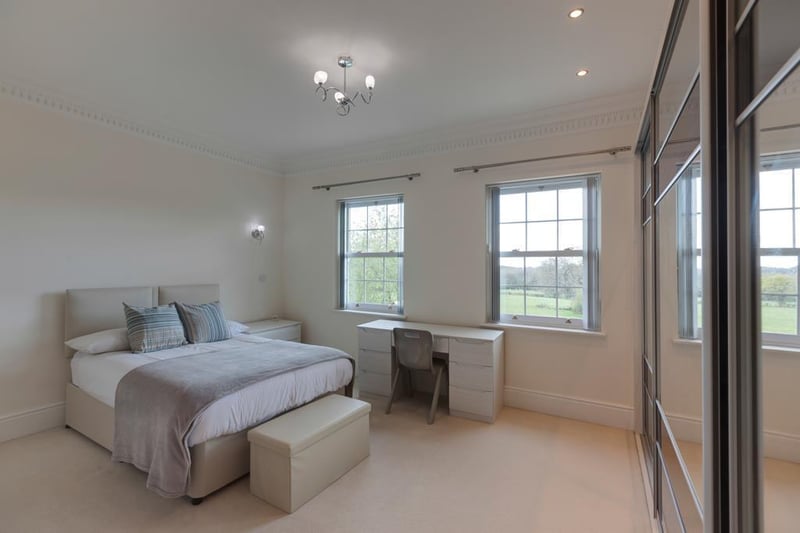Bedroom three, on the first floor, is described as a "fabulous bedroom suite", boasting a range of fitted furniture and an ensuite.
