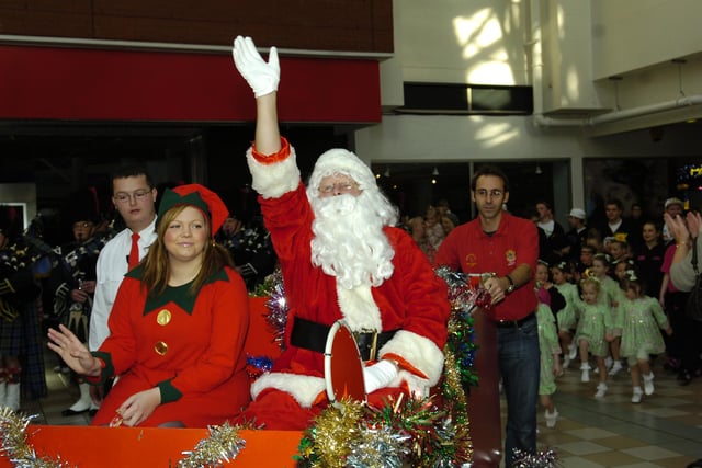 Santa and his elves arrive in the main square in Middleton Grange Shopping Centre in 2011. Were you there?
