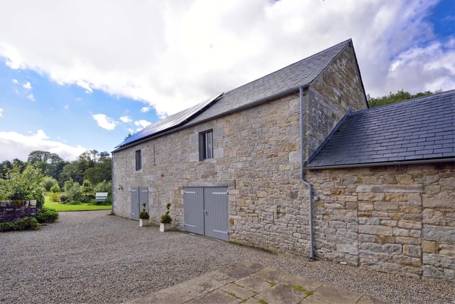 The two-storey barn next to the house, dating back to 1851, has been completely renovated and now comprises garage and stores on the ground floor with a large floored space suitable as a home office, games room or studio upstairs