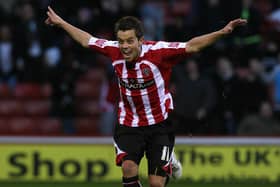 Lee Hendrie, turns away after celebrating for the Blades