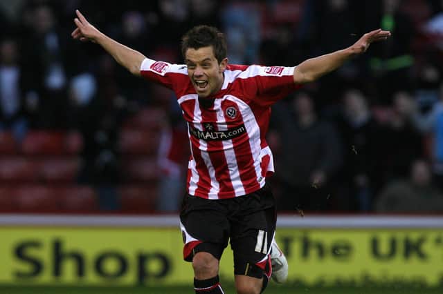 Lee Hendrie, turns away after celebrating for the Blades