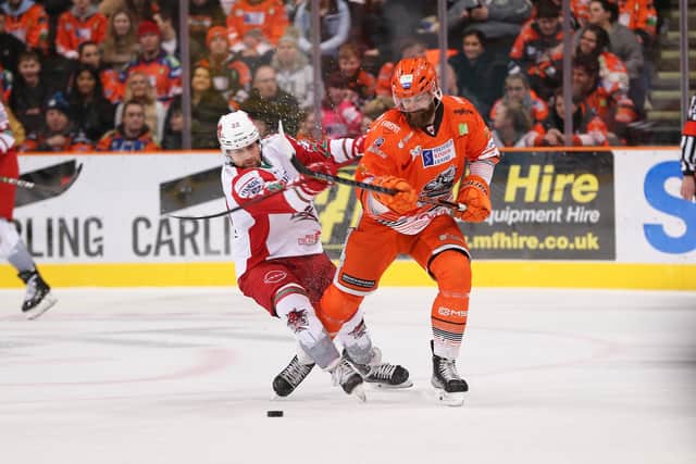 Sheffield Steeers' John Armstrong competes for the puck against Cardiff Devils