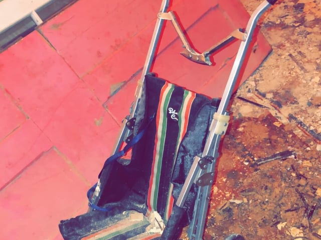 Who grew up in this house? A pram lies deserted in one of the rooms.