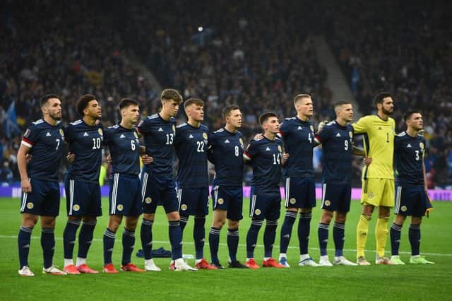 Scotland's players stand during the national anthem ahead of the FIFA World Cup Qatar 2022 Group F qualification football match between Scotland and Israel at Hampden Park in Glasgow on october 9, 2021. (Photo by ANDY BUCHANAN/AFP via Getty Images)
