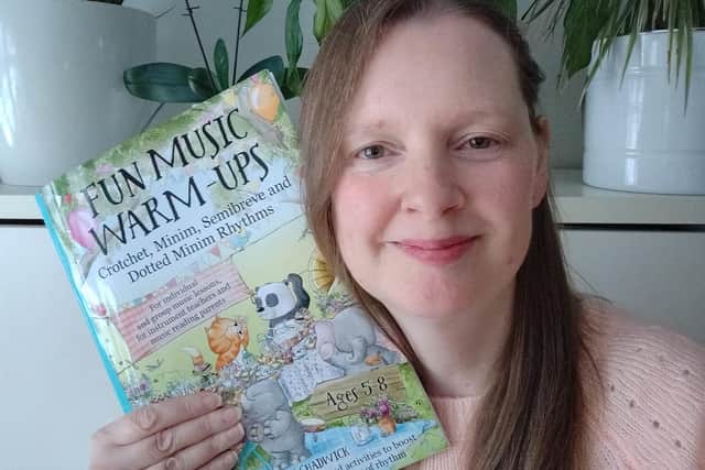 Music teacher, Claire Chadwick with her new music book, 'Fun music warm-ups'