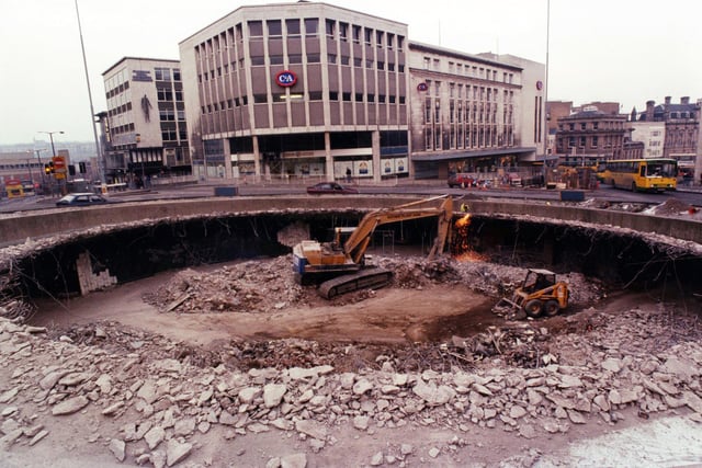 The Castle Square 'hole in the road' being filled in with rubble from the demolition of Sheffield's Hyde Park flats, February 23, 1994
