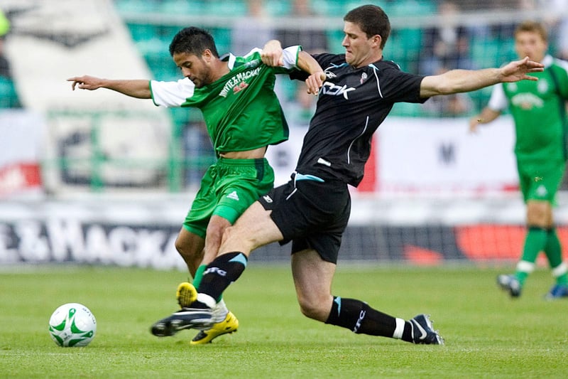 Lubomir Michalik struggles to gets to grips with Hibs' Merouane Zemmama. Steven Fletcher, David Murphy, and Zemmama's compatriot Benji scored in a comprehensive 3-0 win for Hibs