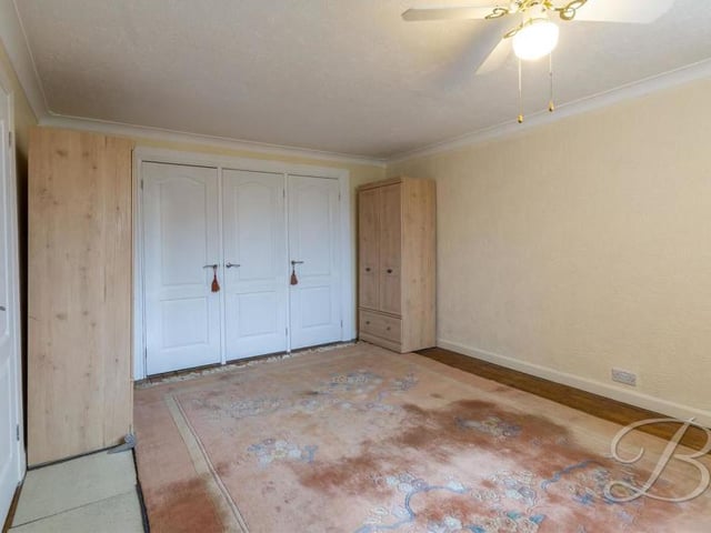 Another view of the main bedroom, complete with its fitted wardrobes.