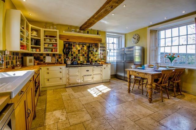 The large kitchen breakfast room features a traditional aga and is triple aspect, benefitting from views to the church. There are also traditional wooden shutters to the larger windows