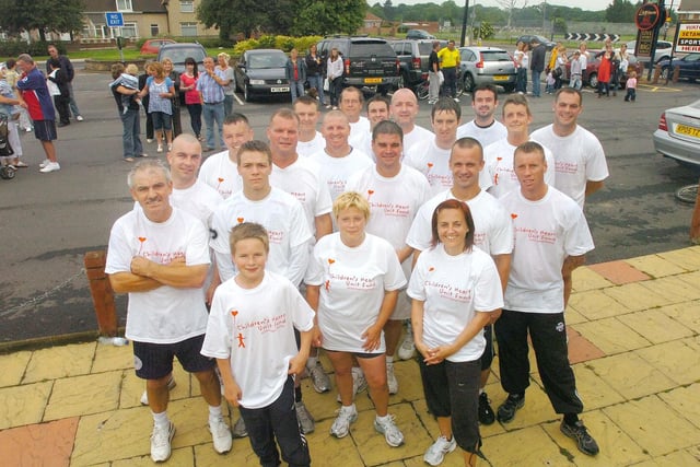 All these runners took part in fundraising in 2009 and here they are outside the Travellers Rest. But what was their chosen cause?