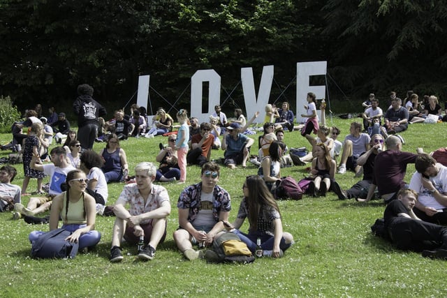 Large signs are displayed around the site reading 'love' and 'peace'. This is the Ponderosa in 2018.