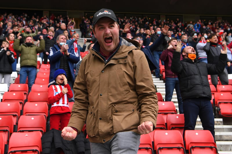 A Sunderland fan celebrates after his team's first goal.