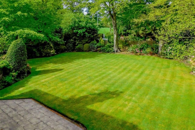 The private gardens comprise beautifully manicured lawns, mature trees and flower borders, with a sun terrace to the rear for outdoor entertaining.
