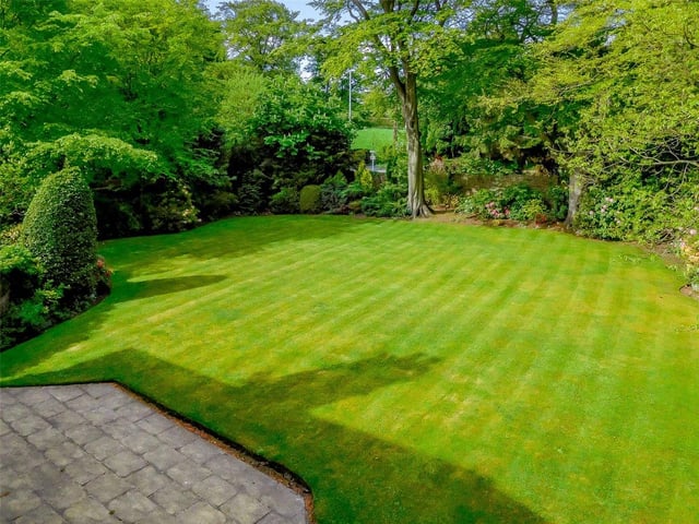 The private gardens comprise beautifully manicured lawns, mature trees and flower borders, with a sun terrace to the rear for outdoor entertaining.