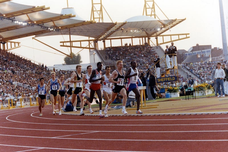 Eventual winner in a UK All Comers Record, No.11, Peter Elliott from Rotherham and second place Steve Cram (No. 1 on the outside) during the 1500m at the McVities Challenge, Don Valley Stadium. Aug 1990.