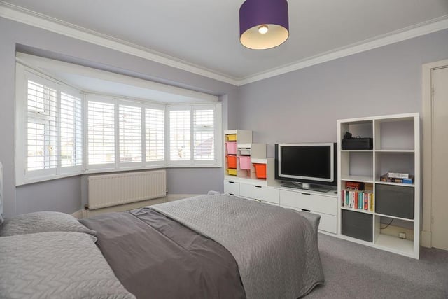 This bedroom benefits from having a large bay window