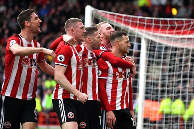Sheffield United's Billy Sharp (right) celebrates scoring his side's goal with teammates and the fans during the win over Norwich City: Anthony Devlin/PA Wire.