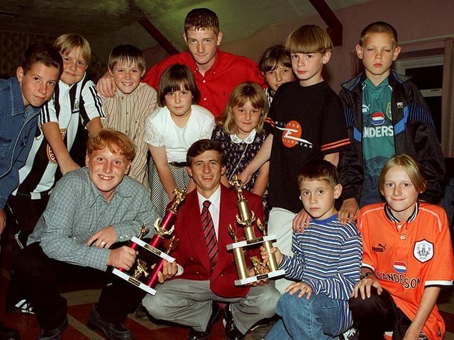 Under 16s winner Steven Stratford and Under 11s winner Shaun Reynolds pictured with Andy Kinder of FX Barnsley Blacks and other prize winners at the Handsworth Junior Anglers presentation night, August 1996