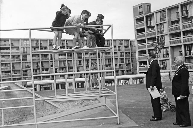 Former Labour leader Hugh Gaitskell chats to children in the playground as he opens Sheffield's Park Hill Flats in 1961