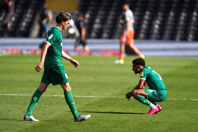 Adam Reach and Jacob Murphy look dejected at the final whistle of Sheffield Wednesday's 5-3 defeat at Fulham.