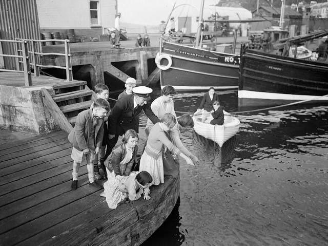 Children fishing during the Glasgow Fair Holidays in 1956.