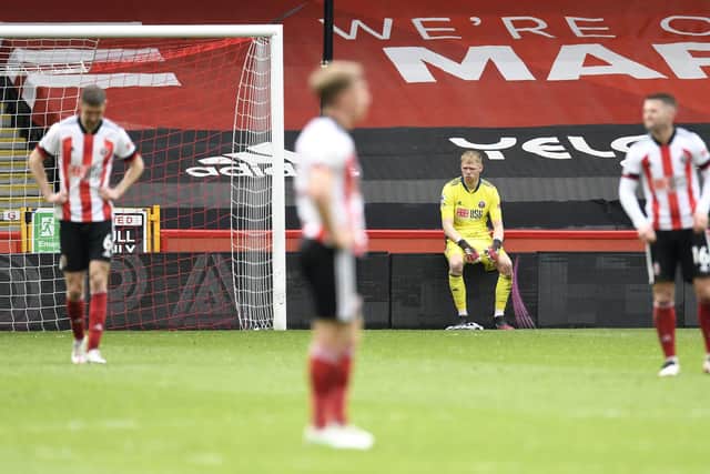 Sheffield United goalkeeper Aaron Ramsdale sits dejected during the Premier League match at Bramall Lane, Sheffield: Peter Powell/PA Wire.