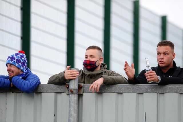 Falkirk fans find a vantage point to watch the game.