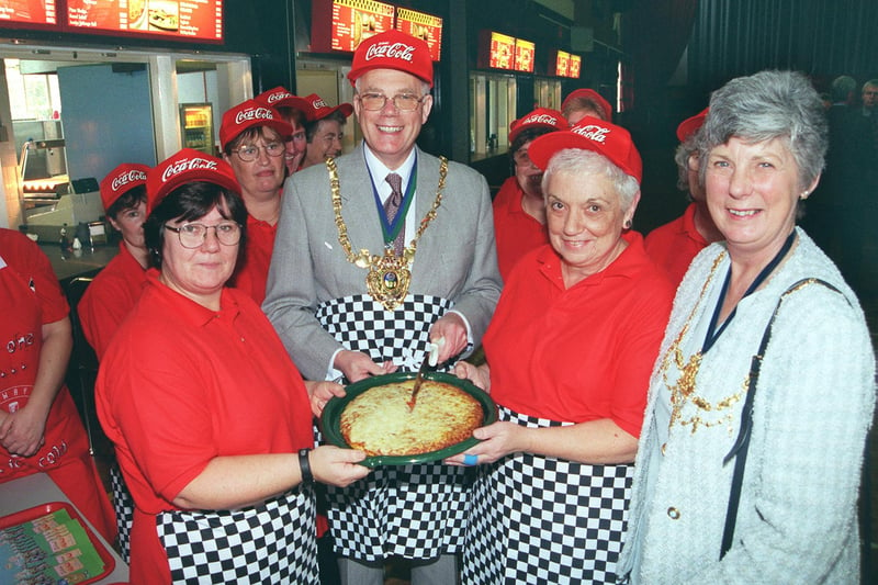 Pictured at Myers Grove school, STannington, Sheffield, where the Lord and Lady Mayoress of Sheffield Coun and Mrs  Trevor and Margaret officially launched the school's new fast food restaurant called The Pit Stop in 1999. Seen is the Lord Mayor as  he cuts the first Pizza with him LtoR is  Pam Lawson the cook supervisor, and Cristine Arthur.