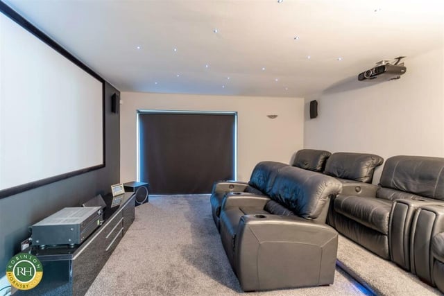 The deluxe cinema room for relaxed film viewing.