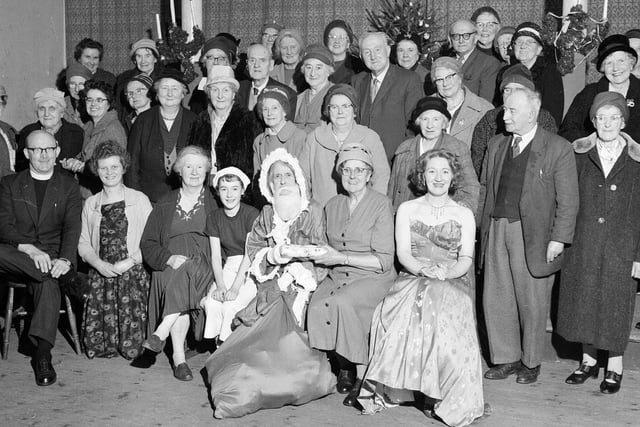 Guests pose for a picture at an OAPs Christmas party hosted by the Newington Lunch Club in 1962.