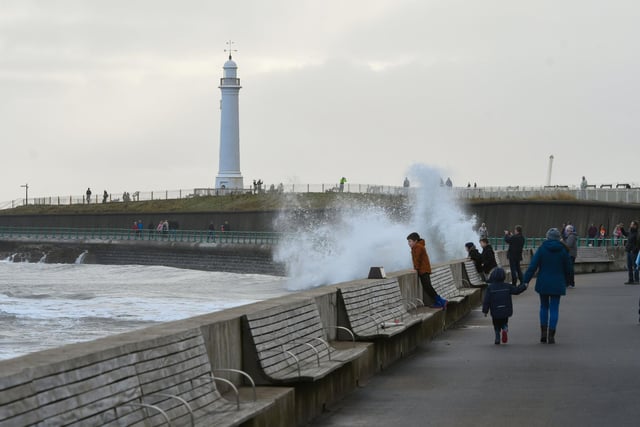 Many found enjoyment in watching the North Sea crash into the promenade at Seaburn.