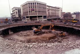 Build in the 1960s in an area that had seen major damage as a result of Nazi bombing during World War Two, the Hole in the Road was a sort of subterranean shopping space in the city centre.The picture from February 1994 shows it being filled in