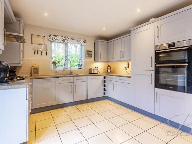 On entering the house, a large hall leads you to this recently updated kitchen. It comes complete with Shaker-style cabinets, complementary work surfaces over, an inset sink and drainer with mixer tap above, and integrated appliances.