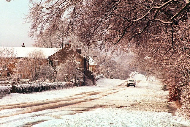  Winter surprise.... the first snows of 1999  which fell on the South West of Sheffield blocking many roads to all but walkers and four wheel drive vehicles..  seen is Ringinglow Road . see story Jill ward...