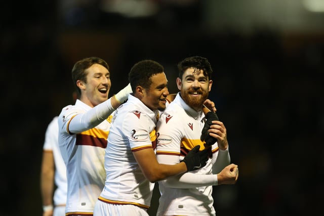 Liam Donnelly celebrates putting Motherwell 1-0 up with team-mates Chris Long and Jermaine Hylton. This completed a nightmare start for Killie who had earlier lost defender Alex Bruce to a straight red card for a foul on Long.