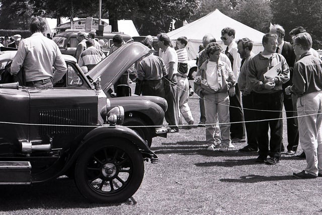 People admire the cars on display at the Sheffield Motor Show and Family Gala at Graves Park, July 1990