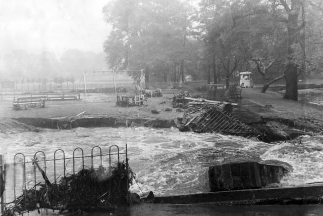 Flood torrents in Millhouses Park swept away part of a bridge in July 1958