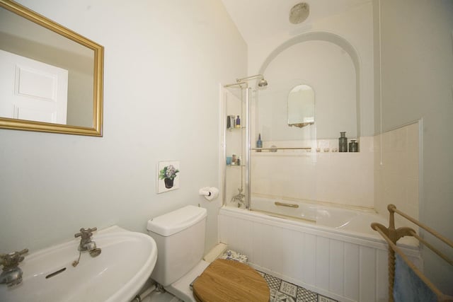 The impressive decor can even be seen in the stylish bathroom which is tiled and features vintage fixtures and fittings.