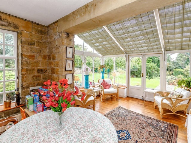This bright family room is south facing, making it bright and airy, and enjoys lovely views across the gardens.