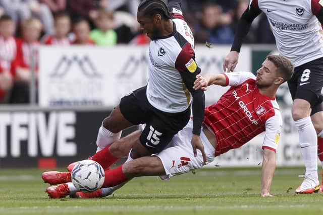 Mahlon Romeo of Portsmouth is tackled by Dan Barlaser of Rotherham United during the Sky Bet League One match between Rotherham United and Portsmouth at New York Stadium on October 16th 2021 in Rotherham, England. (Photo by Daniel Chesterton/phcimages.com)