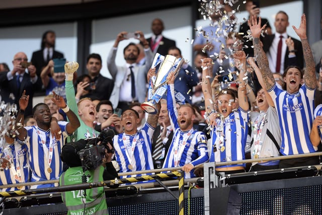 Sheffield Wednesday players lift the trophy     Pic Steve Ellis