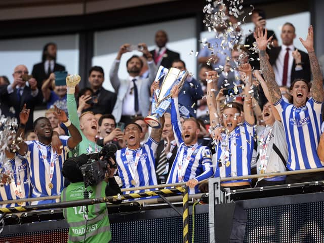 Sheffield Wednesday players lift the trophy     Pic Steve Ellis