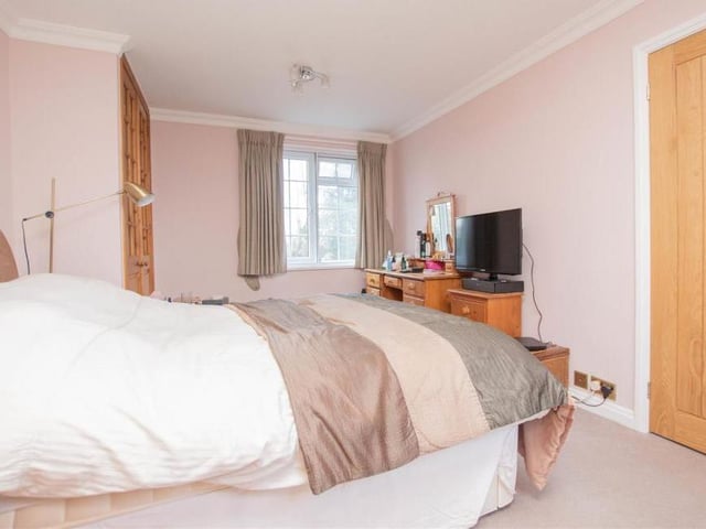 This bedroom is a nice size, offering plenty of space as well as comfort. Good views too from the window.