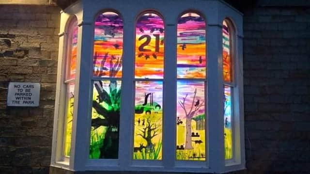 "Pitsmoor Solstice" Advent display in the window of Abbeyfield park house celebrating the 21st day of Advent.