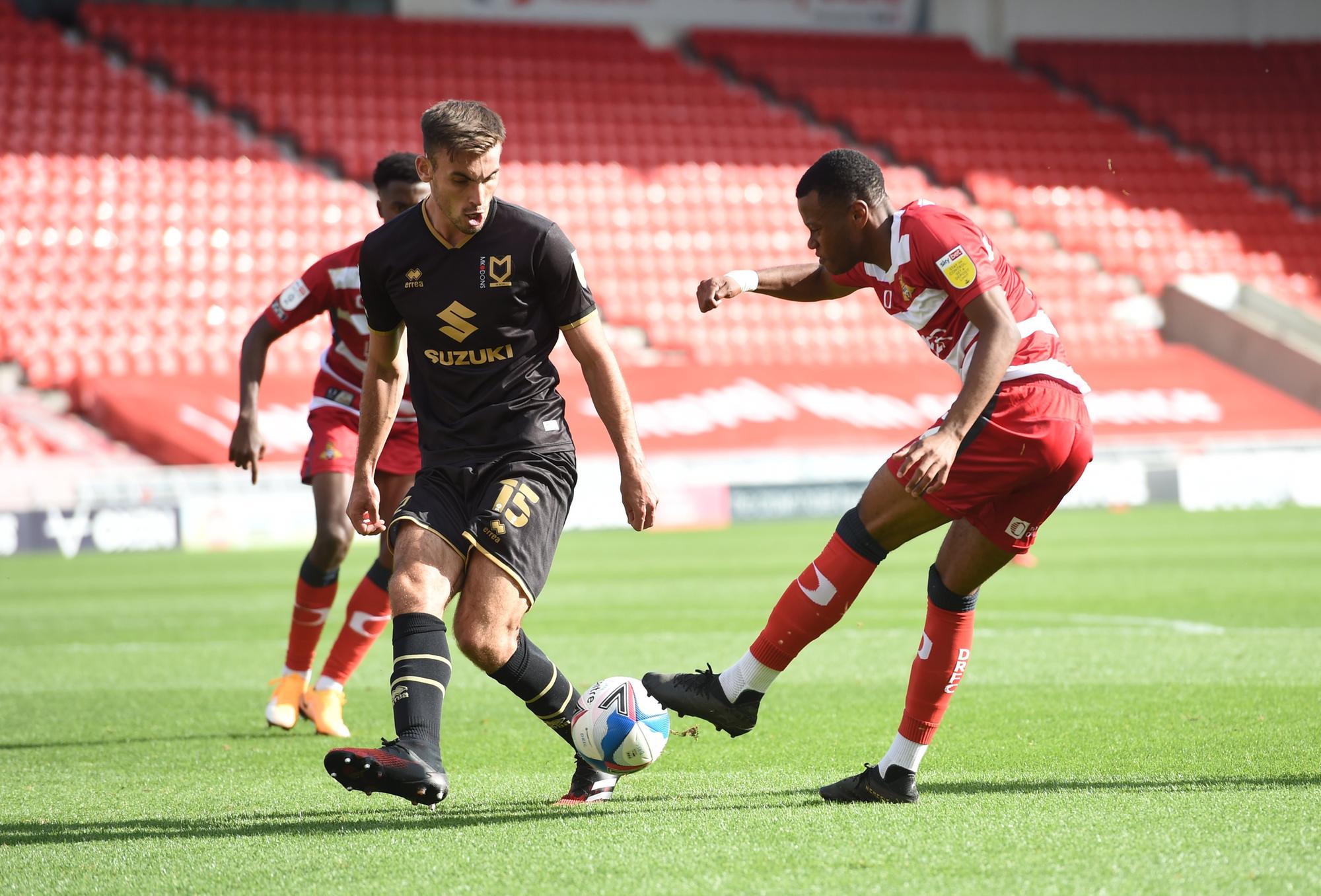 Rayhaan Tulloch gets a shot away against MK Dons. Picture: Howard Roe/AHPIX